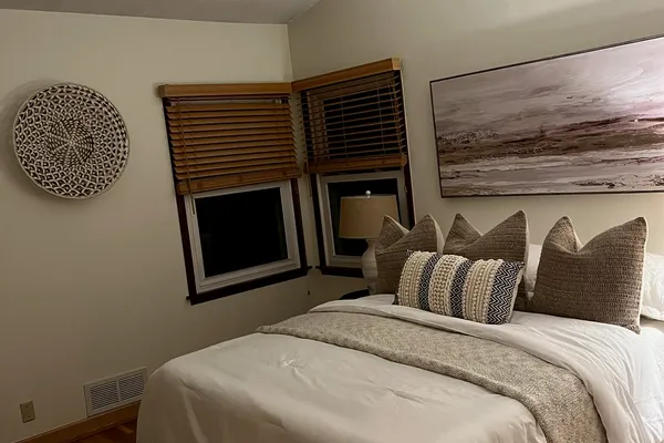Beautifully painted bedroom with warm neutral tones in Fort Collins home