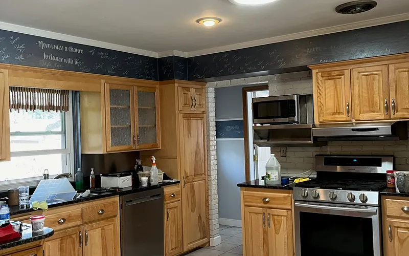 Kitchen with freshly painted walls and chalkboard accent