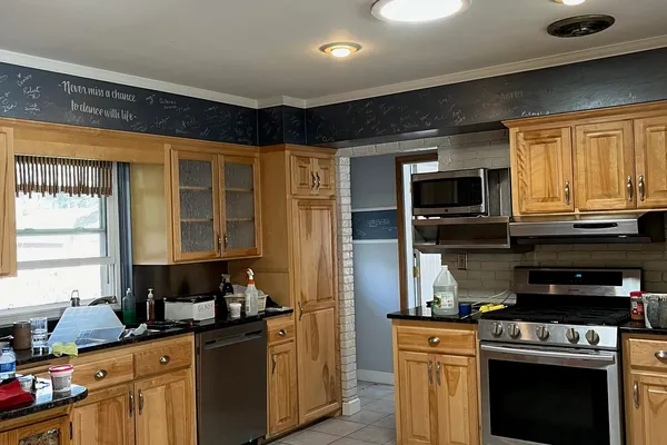 Kitchen with freshly painted walls and chalkboard accent in Fort Collins
